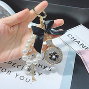 韩版镶钻香水瓶包挂件钥匙扣女珍珠串蝴蝶结手机吊饰挂件时尚创意