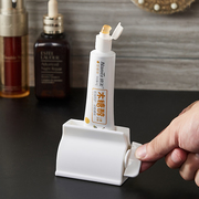 日式挤牙膏器牙膏夹洗面奶护手霜置物架挤压器手动懒人牙膏卷压器