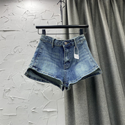 2024春夏季韩版女装高腰，设计感不规则，a字型牛仔短裤蓝色热裤