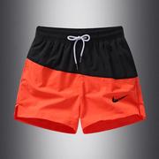 橙色运动短裤男款夏季薄款冰丝速干沙滩裤，健身休闲跑步深蹲三分裤